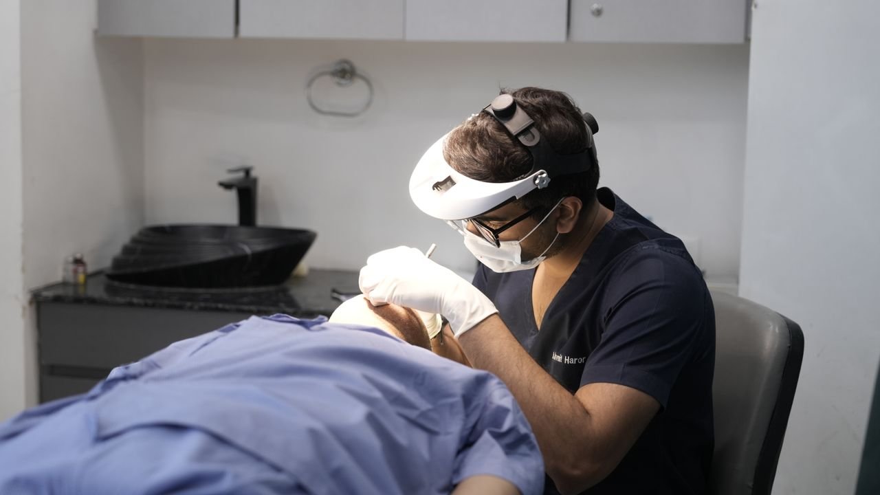 pexels photo 32260064 32260064 A dermatologist performing a procedure in a clinical setting in Delhi, India.